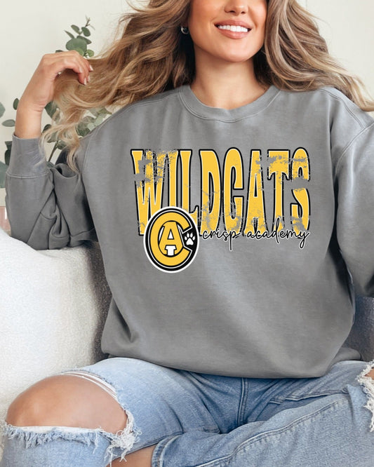 Gray Comfort Colors sweatshirt with bold yellow “Wildcats” lettering and Crisp Academy logo, modeled casually indoors.